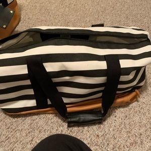 Over night bag with compartment at the bottom
